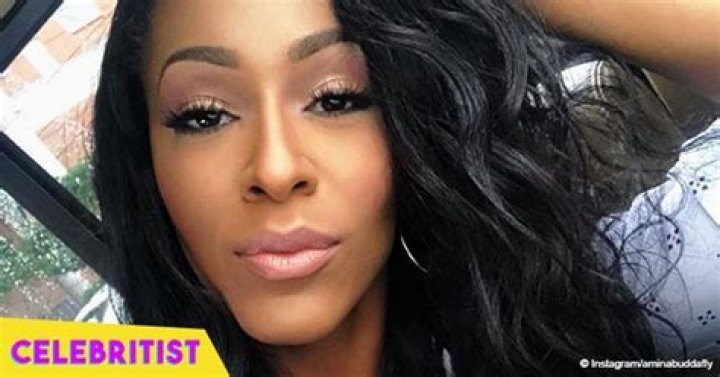 Amina Buddafly shows off massive piano keys tattoo in purple bikini