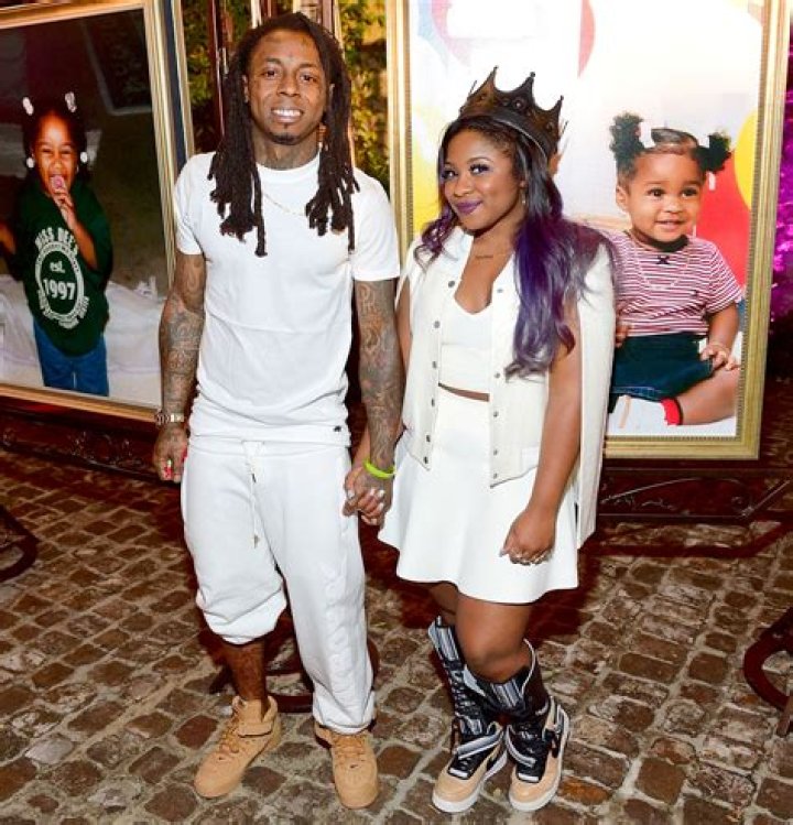 Lil Wayne's daughter Reginae Carter and her baby sister are all smiles in matching denim dresses