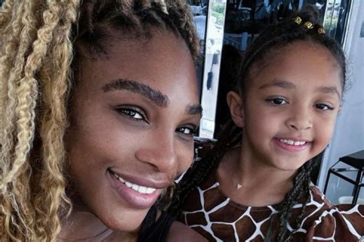 Serena Williams' daughter, 1, flaunts her thick hair in purple outfit & sparkling shoes in new pic