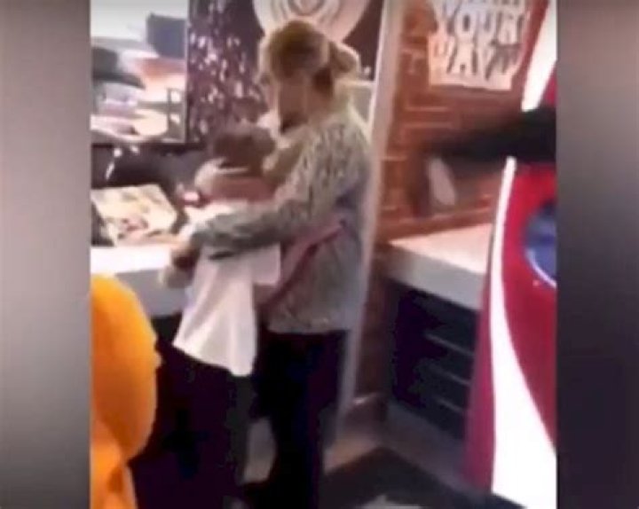 Rowdy guy laughs as he throws drink over mom and horrified son at Burger King