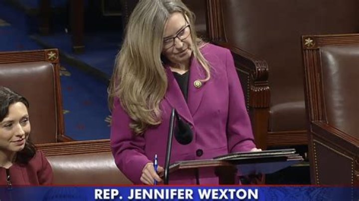 Rep. Jennifer Wexton hangs a Transgender Pride Flag outside her Capitol Hill Office