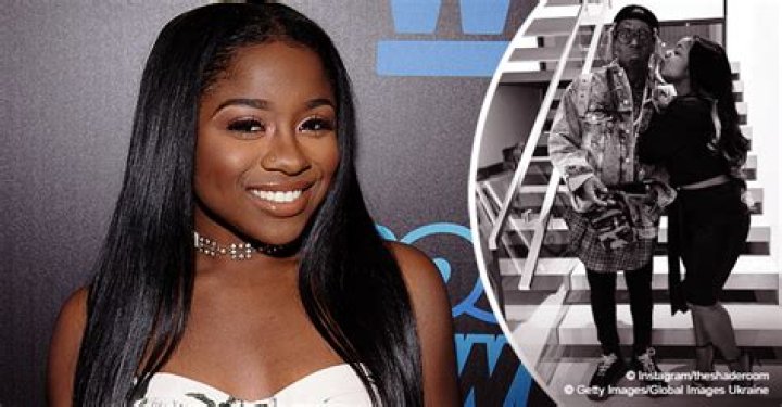 Reginae Carter Gives Father Lil Wayne a Kiss on the Cheek in Rare Photo