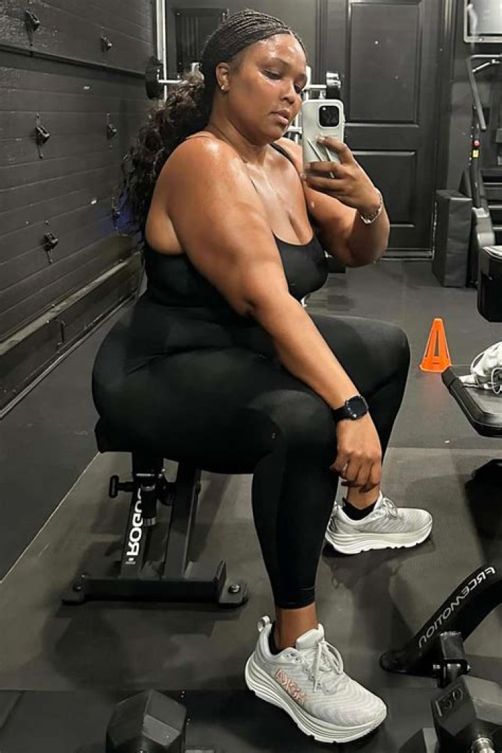 Vanessa Simmons Flaunts Her Figure in a Bright Red Outfit and a Leather Jacket While Posing Outdoors