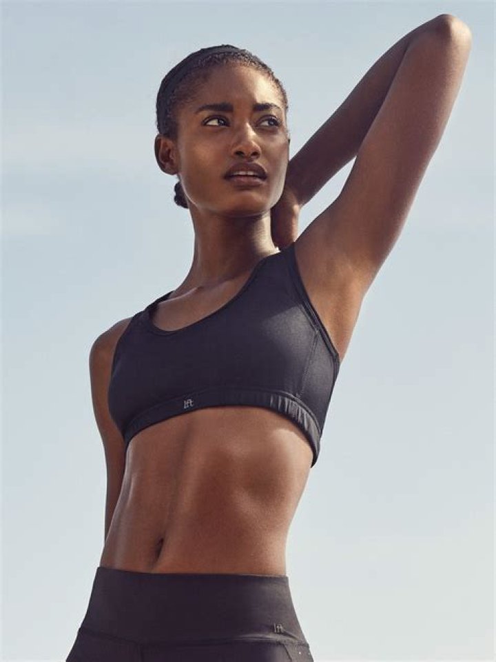 Check Out Nicole Murphy's Toned Body in a Swimsuit & Matching Pareo While Walking in High Heels