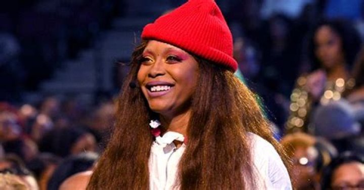 Check Out Erykah Badu as She Flaunts Her Figure in a Nude Swimsuit & Stockings in Stunning Pic