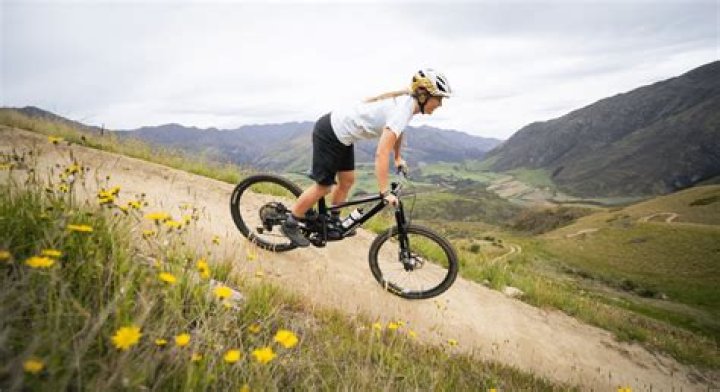 Tamron Hall Smiles with Her Son Who Wore a Helmet While Riding on the Back Seat of Her Bicycle