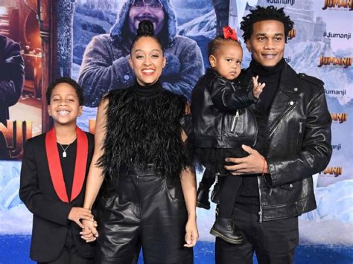 Tia Mowry's Kids Cree & Cairo Open Christmas Presents in Cute Matching Outfits with Their Dad