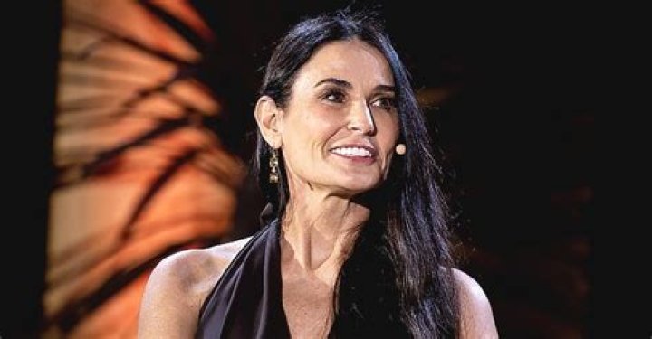 Demi Moore Defies Her Age Wearing Chic Glasses & a Black T-Shirt While Posing with a Sloth
