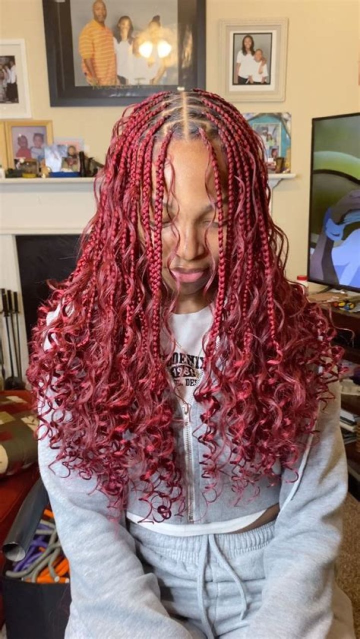 Rapper Eve Bewitches with Burgundy Braids as She Poses in a Suit & Yellow High Heels