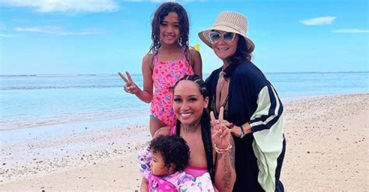 Chris Brown's Daughter Wears a Pink Swimsuit Posing on the Beach with Her Mom, Sister & Grandma