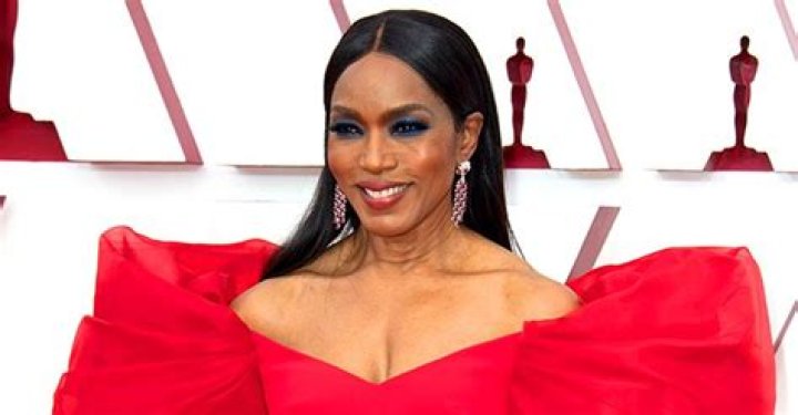 Angela Bassett Bares Cleavage at the 2021 Oscars in a Red off-Shoulder Dress with Puff Sleeves