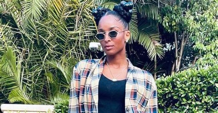 Ciara Grabs Attention Wearing Two Hair Buns in a Long Checkered Shirt & Heavy White Boots