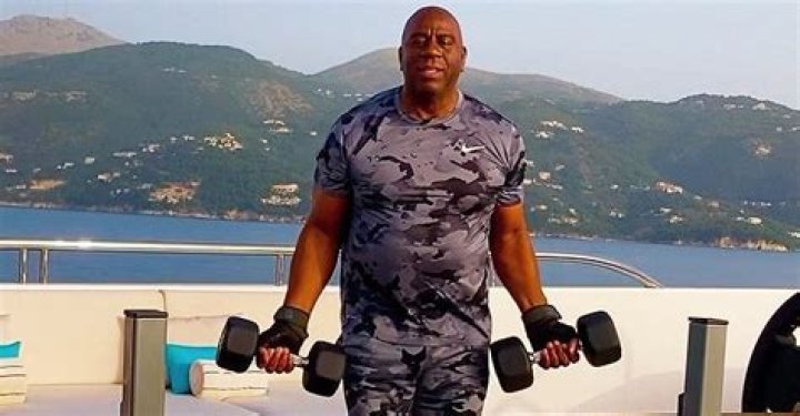 Magic Johnson Looks Half His Age Lifting Weights in a Camo Outfit While Vacationing on a Yacht