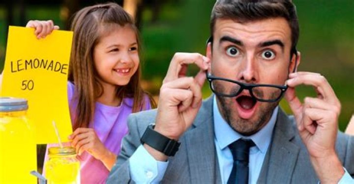 Little Girl Is Selling Homemade Lemonade and Brownies on the Street