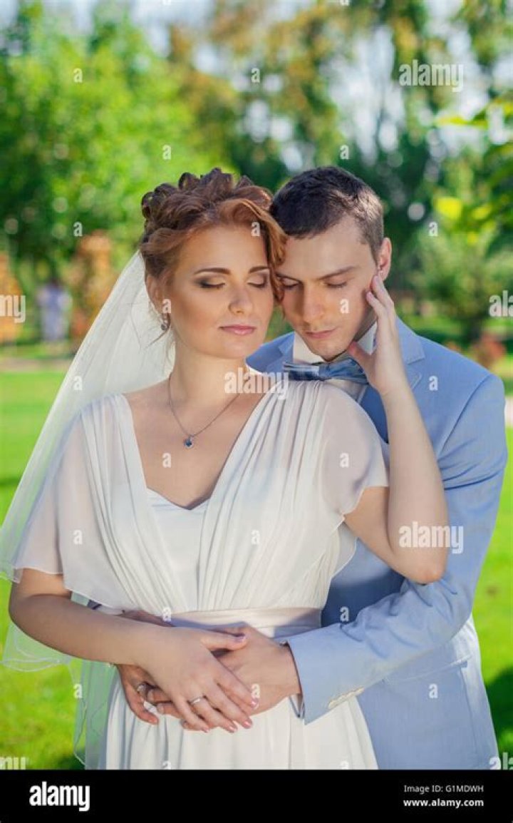 Gabby Sidibe's Fiancé Gently Embraces Her Waist Poured into Long White Printed Dress Near the Pool