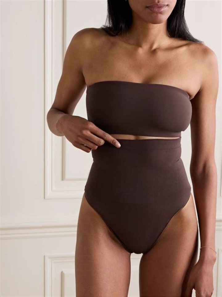 Brandy Showcases Killer Legs in High-Waisted Skinny Shorts & Blue Heels Posing in New Photoshoot