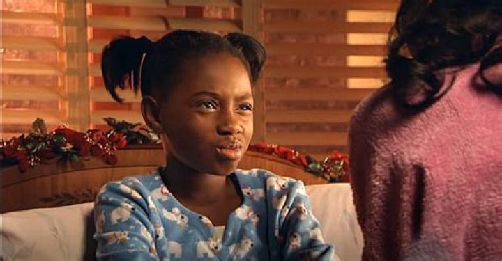 Imani Hakim AKA Tonya from ‘Everybody Hates Chris’ Showcases Long Legs in White Belted Mini-Dress in Front of Lavish Car