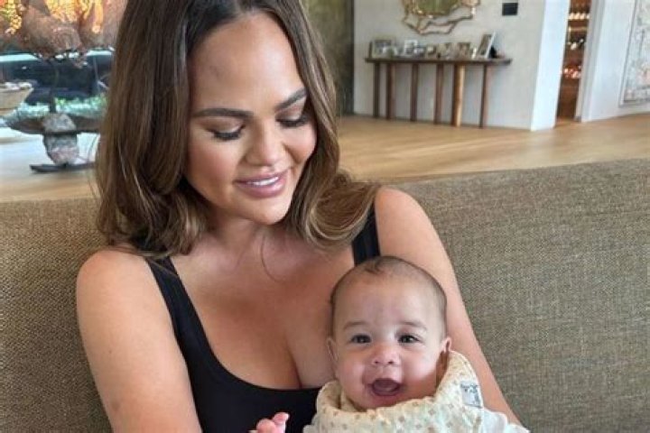 Chrissy Teigen Shares Adorable Snap of Her & John Legend’s Daughter Looking like Grandma with Pink Ribbon