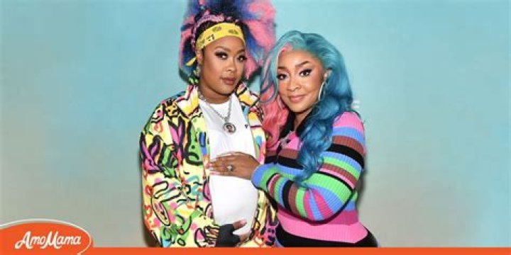 Da Brat Displays Her Baby Bump Cradled by Wife Jesseca after Child’s Gender Reveal