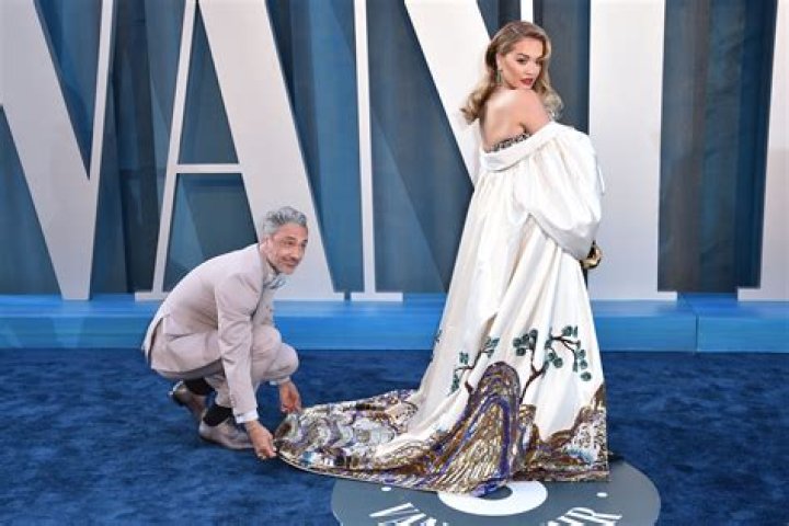 Fans Poke Fun at Taika Waititi as He Appears to Wear Rita Ora’s Fishnet Dress in Photoshoot