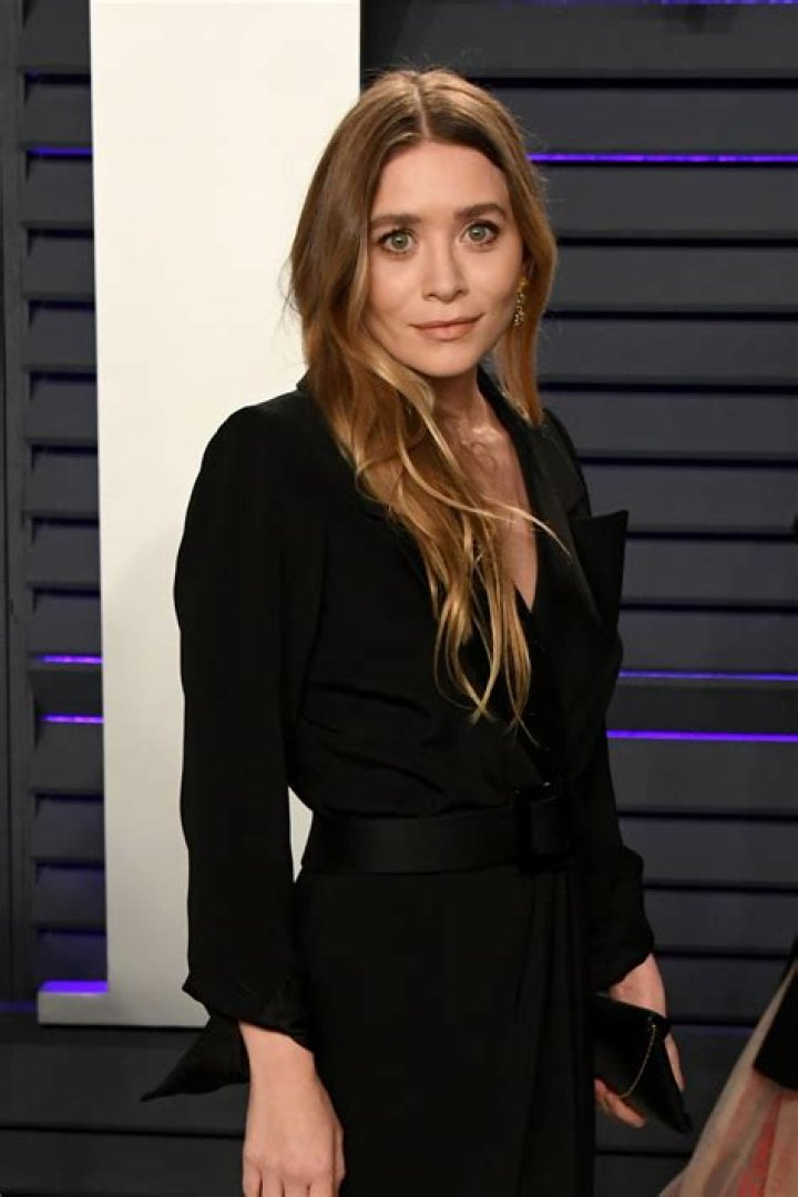 Ashley Olsen Spotted in Oversized Coat & Wide-Legged Faded Jeans after TMZ Reported She Gave Birth at 37
