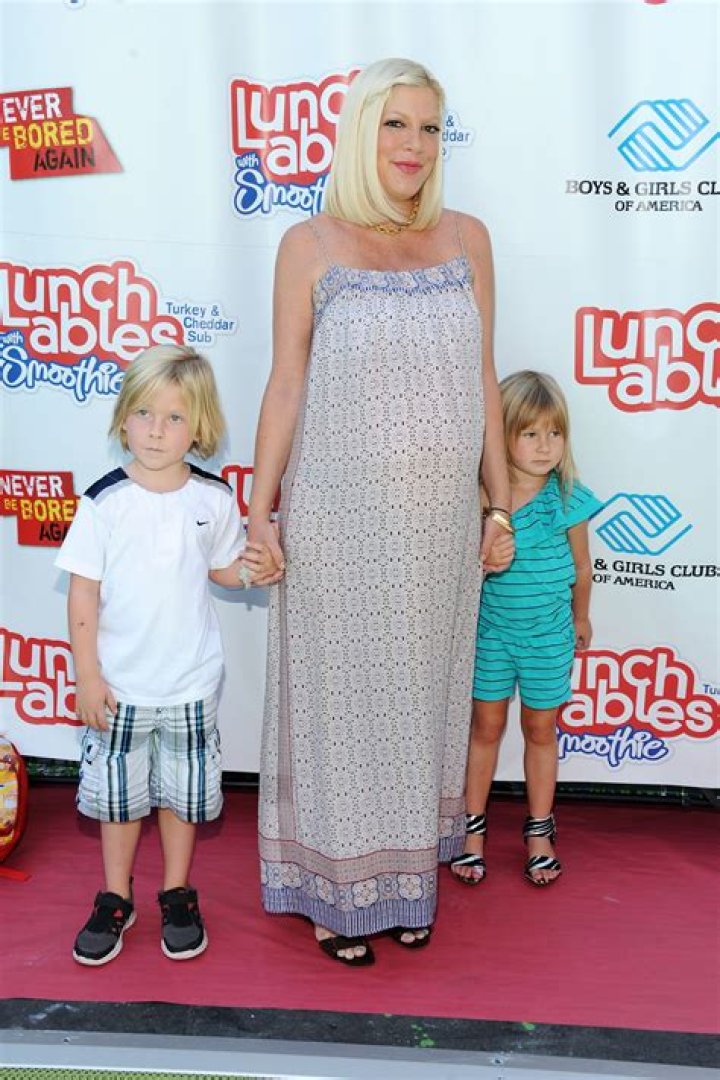 Tori Spelling, 50, Displays Toned Abs in Sheer Top & Low-Hanging Pants, Igniting Reactions