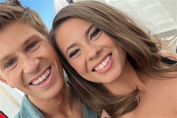 Bindi Irwin shares a touching photo with her beau as they are seen cuddling up to one another