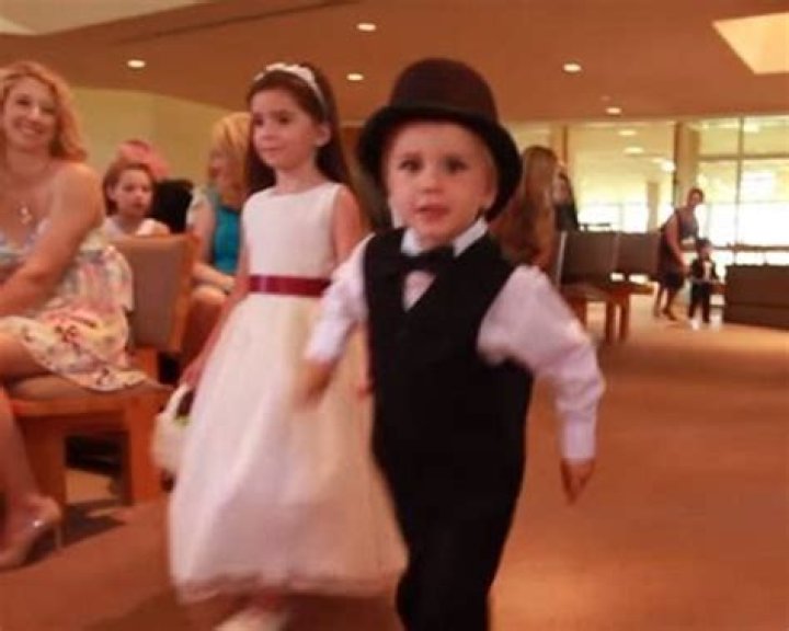 Little ring bearer makes such a hilarious entrance that guests laughing hysterically